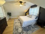 Primary bedroom with a king size bed and smart TV